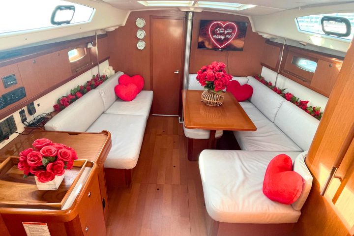 boat rides nyc romantic with red roses and white upholstery