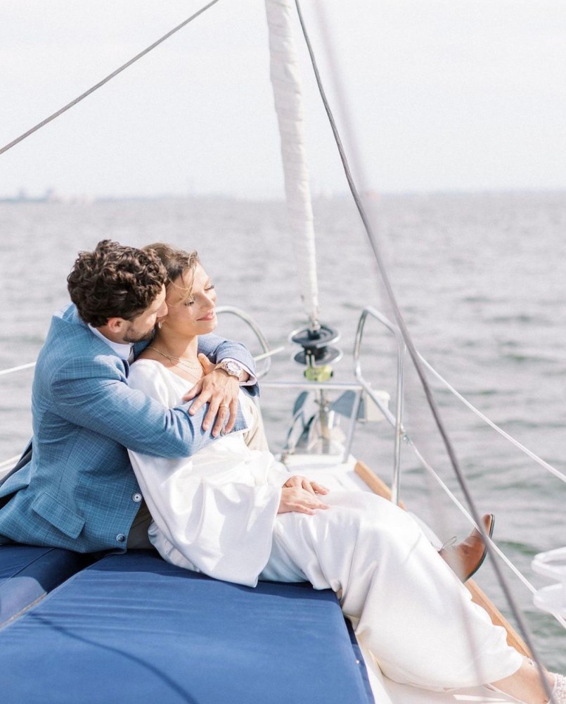 a person sitting in a boat on a body of water